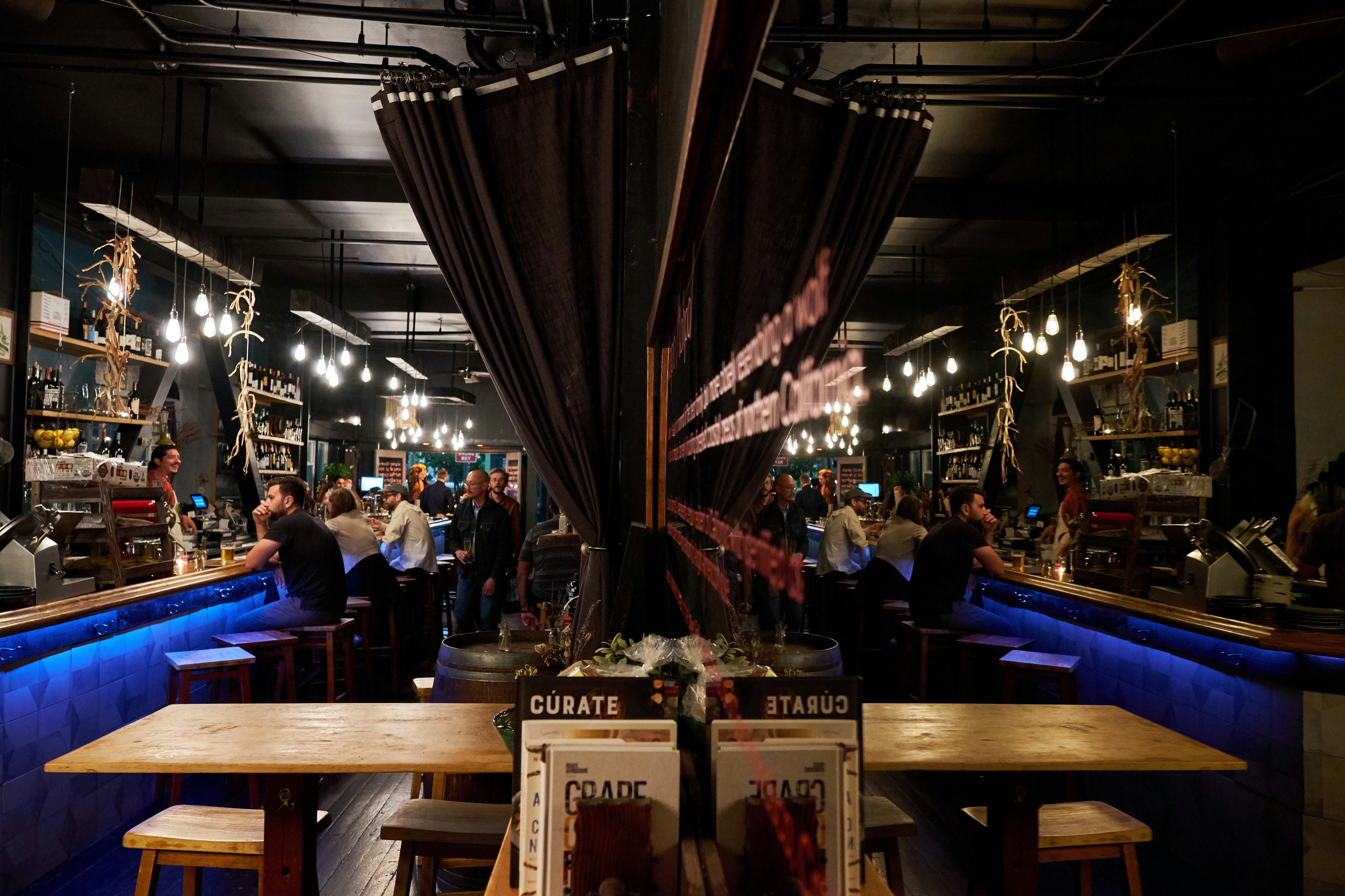 Three large high-top tables in the front at El Lopo